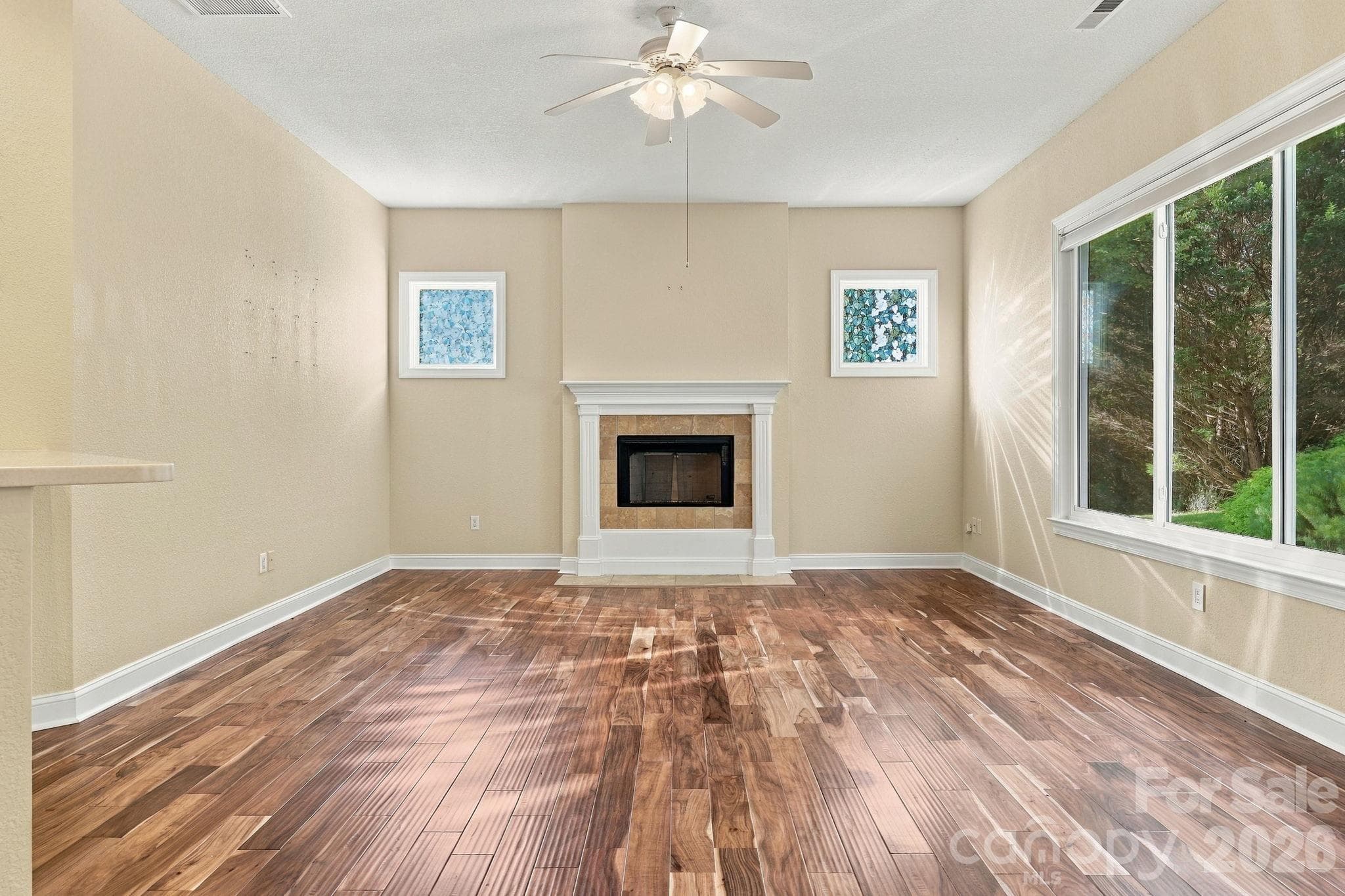 gas fireplace with large windows - 57 Talon Trail Lane, Etowah