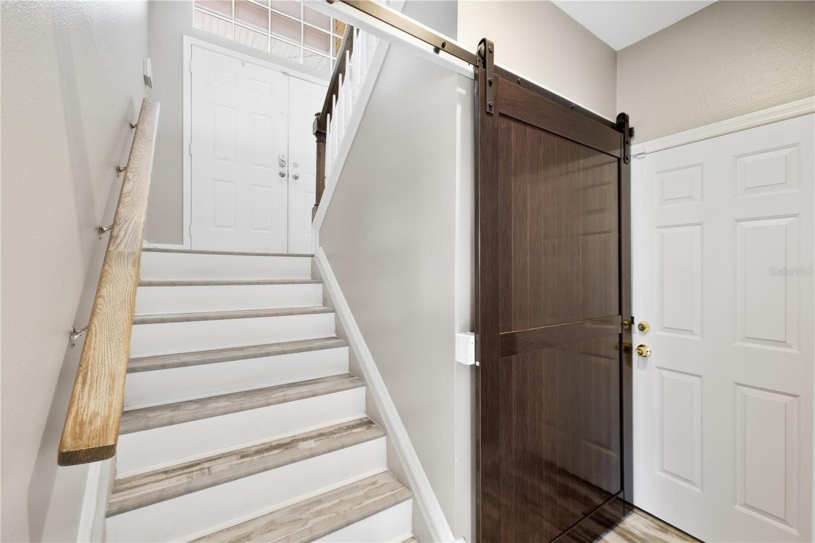 stairs leading down to huge amounts of bonus space or room for in law suite and guests! - 6244 SPOONBILL DR, NEW PORT RICHEY