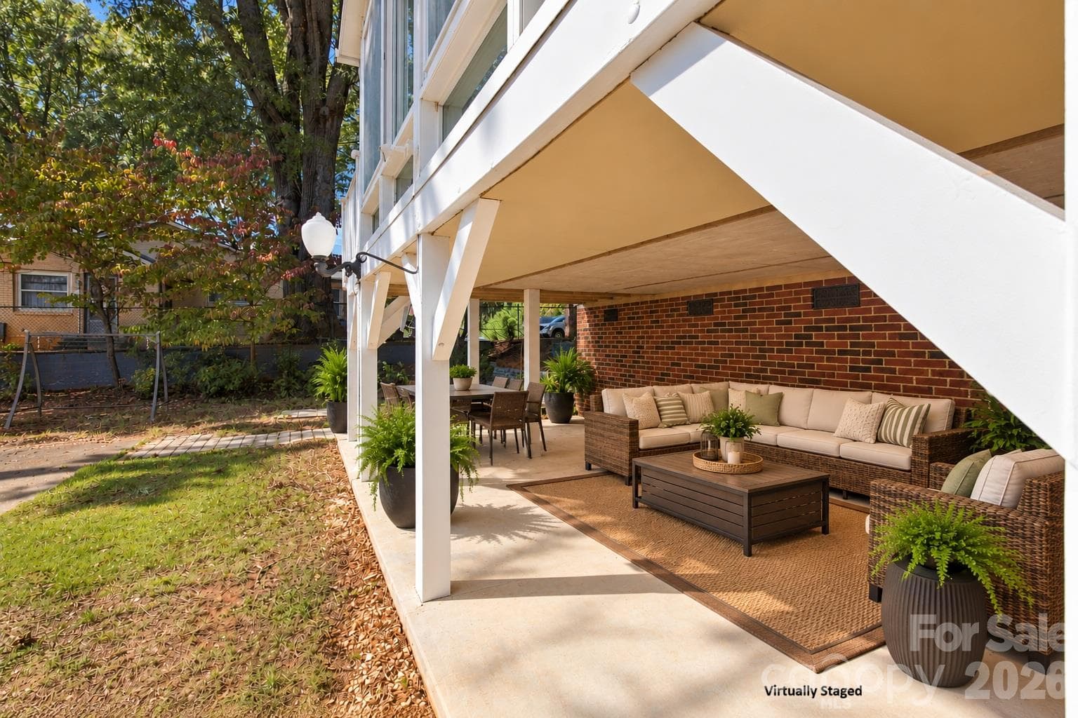 virtually staged patio area under sunroom - 217 23rd Street NW, Hickory