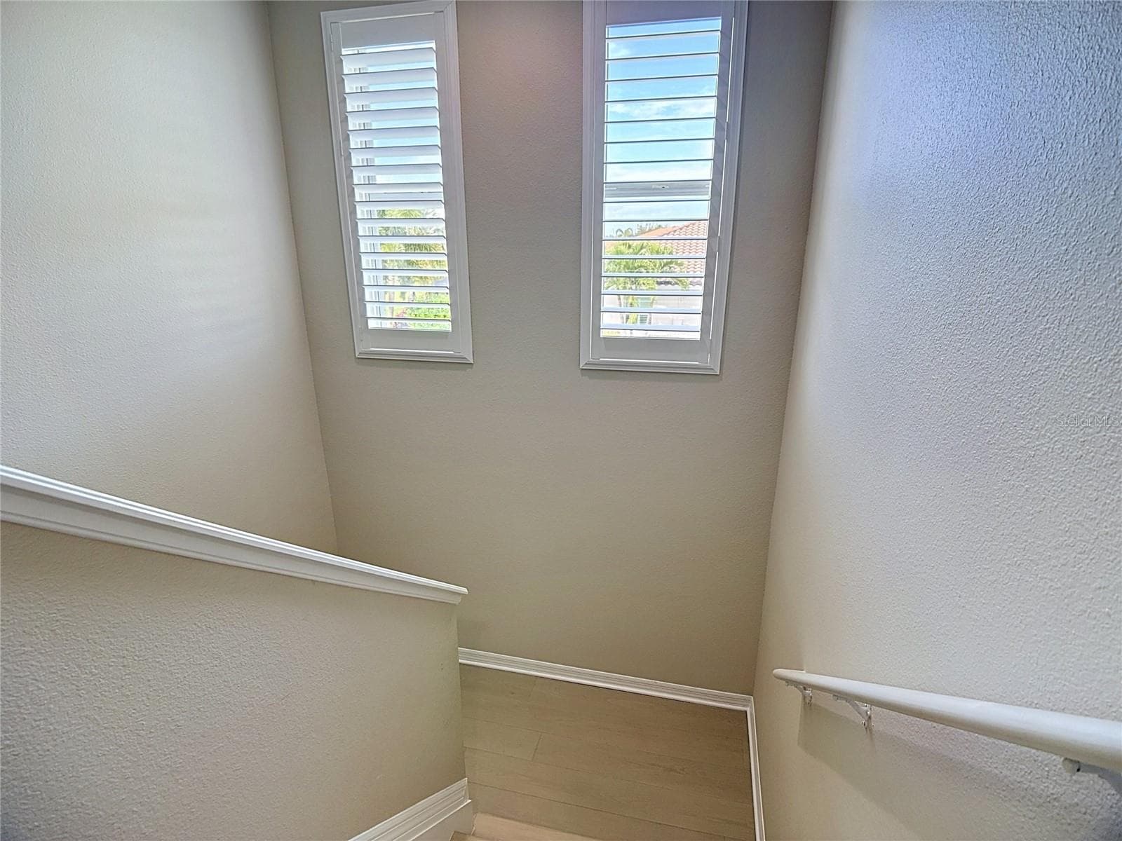Stairs w/ Luxury Vinyl and Plantation Shutter - 17014 E 2ND AVE, BRADENTON