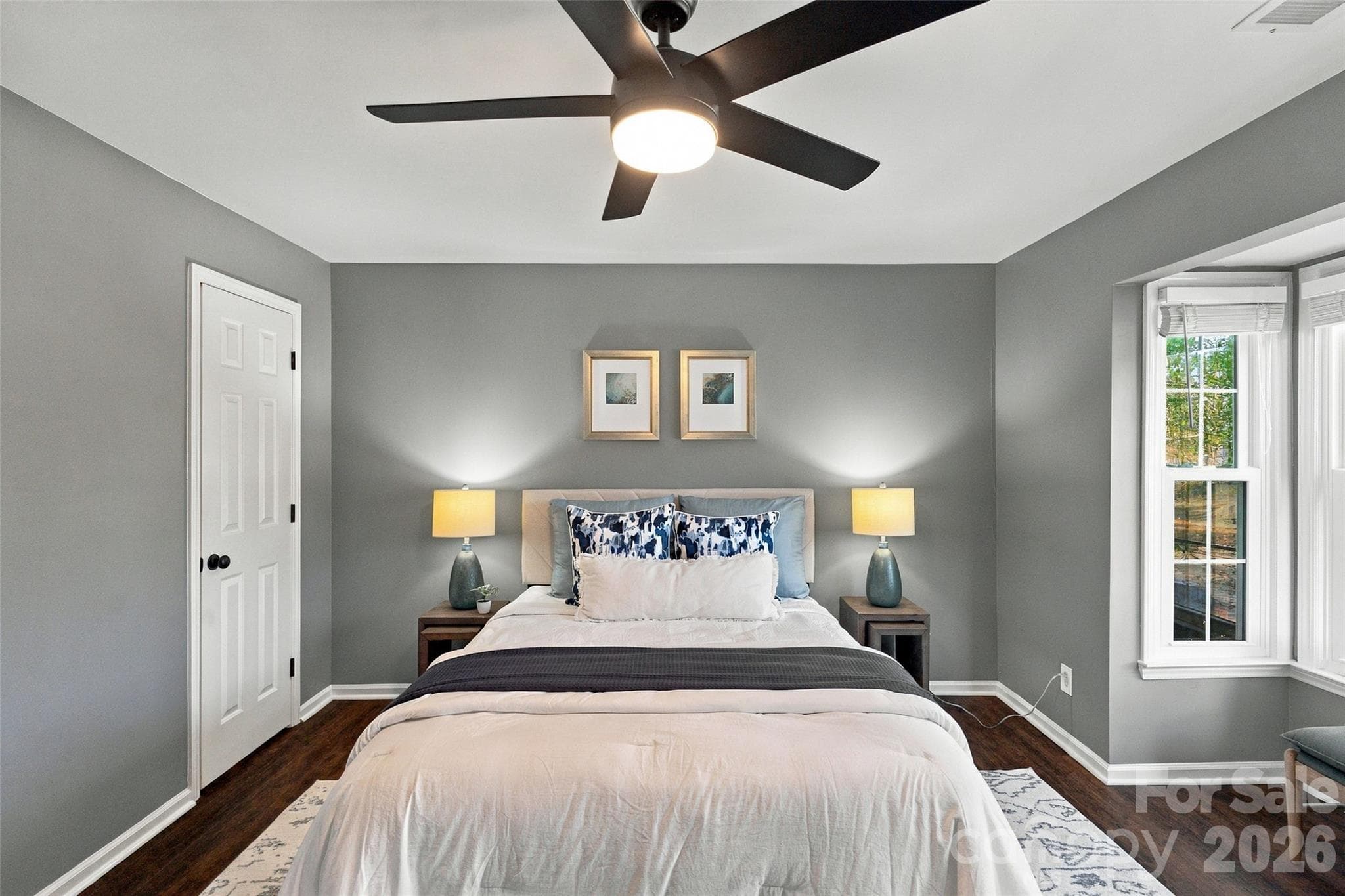Spacious primary bedroom with ceiling fan and abundant natural light - 762 Marsh Road, Charlotte