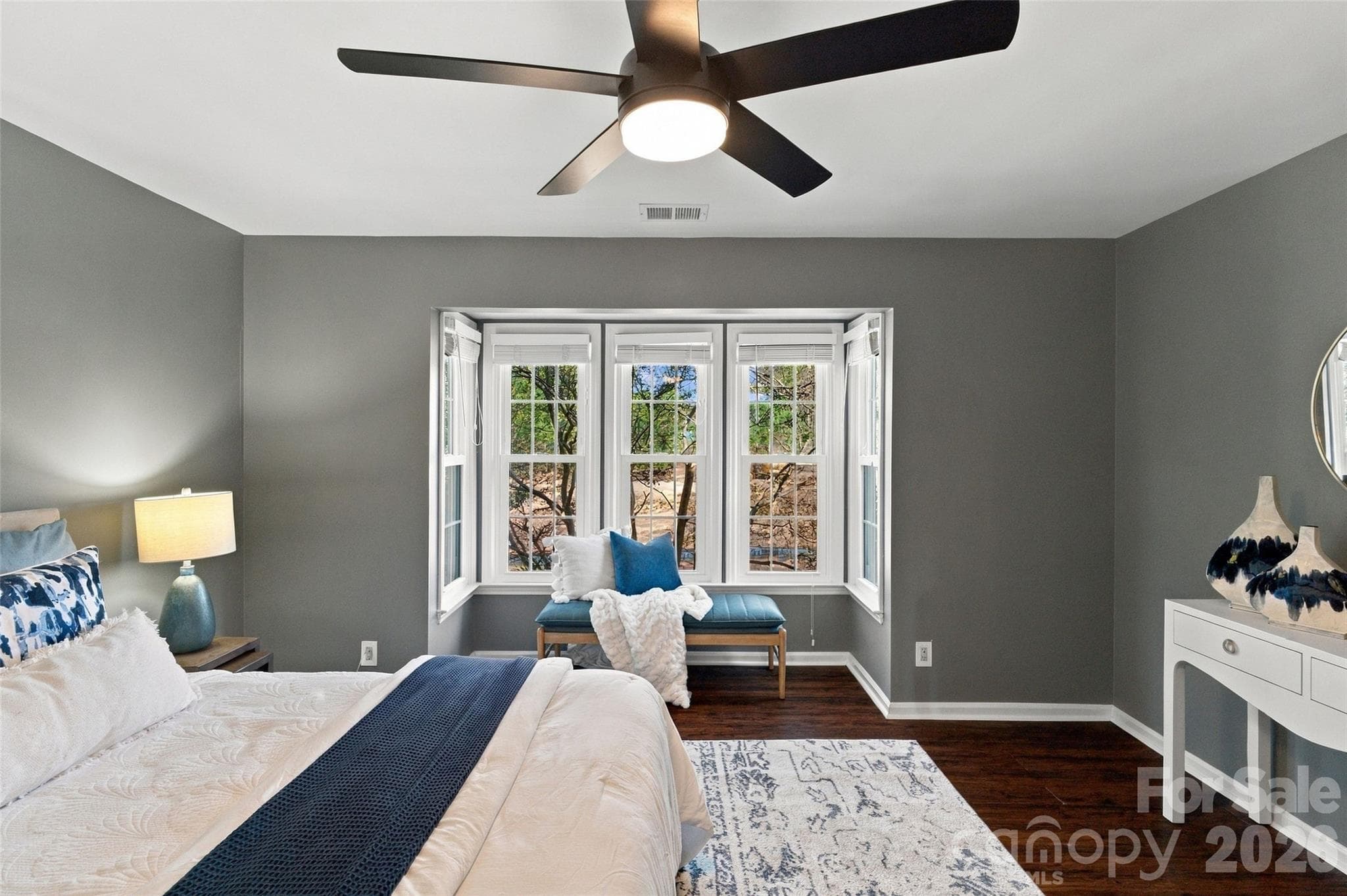 Spacious primary bedroom with ceiling fan and abundant natural light - 762 Marsh Road, Charlotte