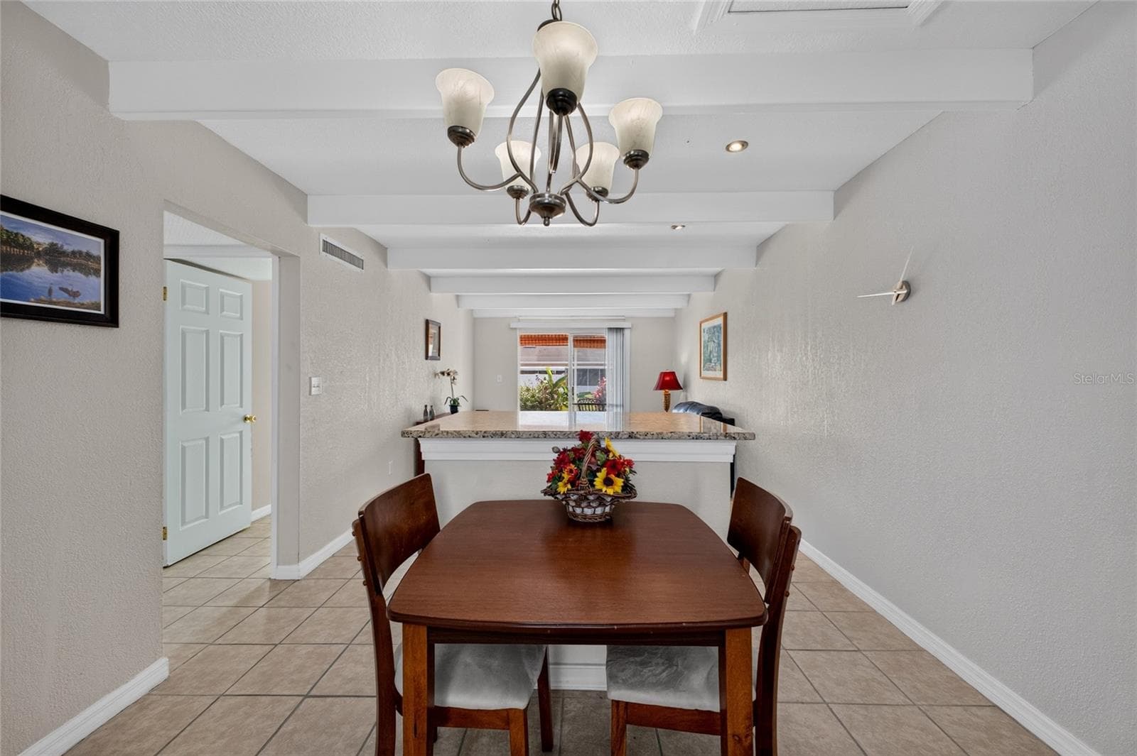Open floor plan in the living room and dining area. - 4409 CLUB CIR, LAKE WALES