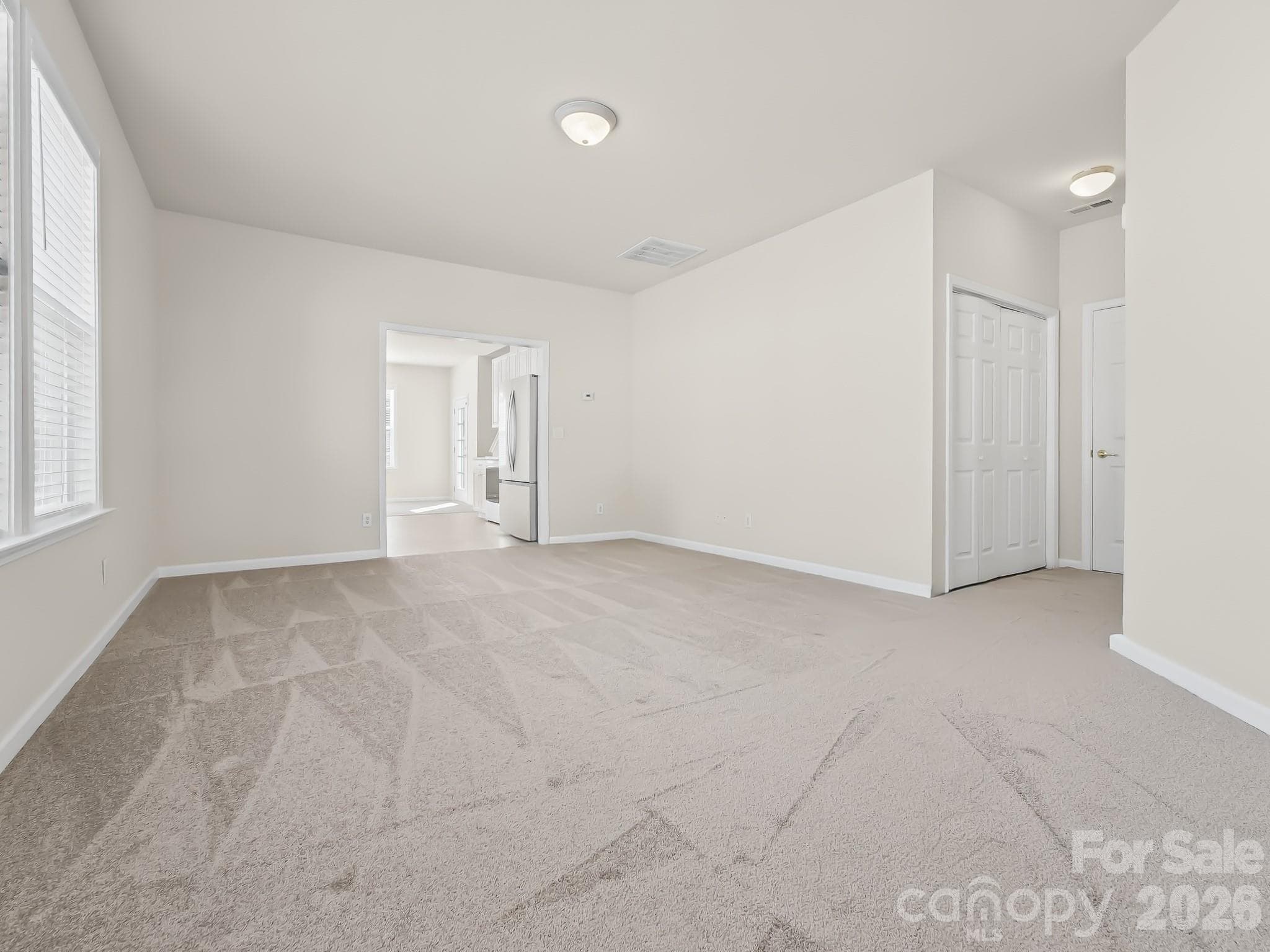 So much space in this living room that opens to the kitchen - 15 Chowan Drive, Fletcher