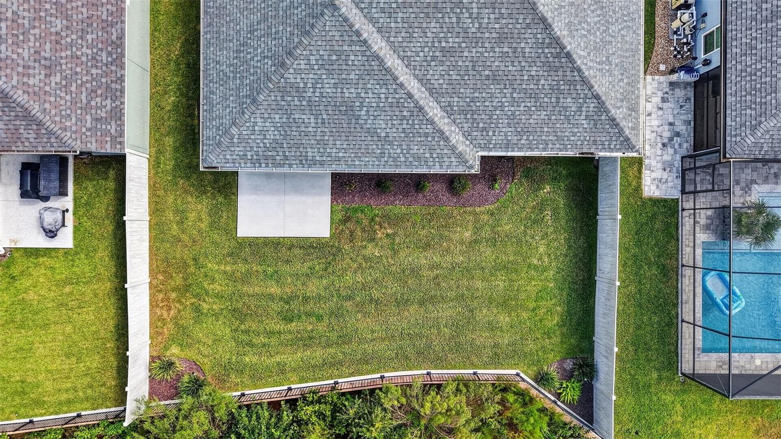 Aerial Rear Elevation with with Fully Fenced Yard and ROOM FOR a POOL! - 7778 BRIAN ETHEREDGE WAY, THE VILLAGES