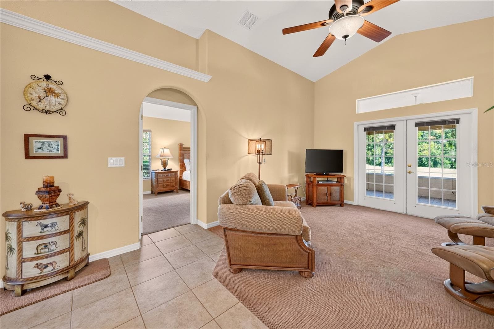 Arched doorway to primary bedroom - 90 GOLFVIEW CIR, UMATILLA
