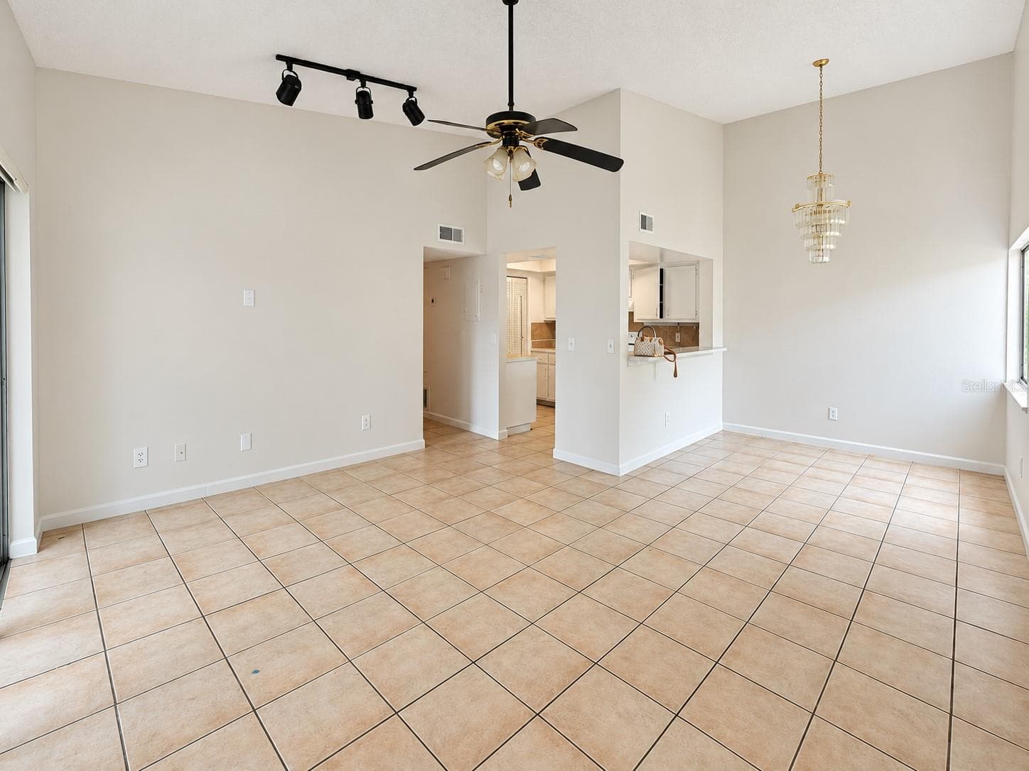 Spacious living and dining viewed from entry. - 2527 CITRUS CLUB LN #3904, ORLANDO
