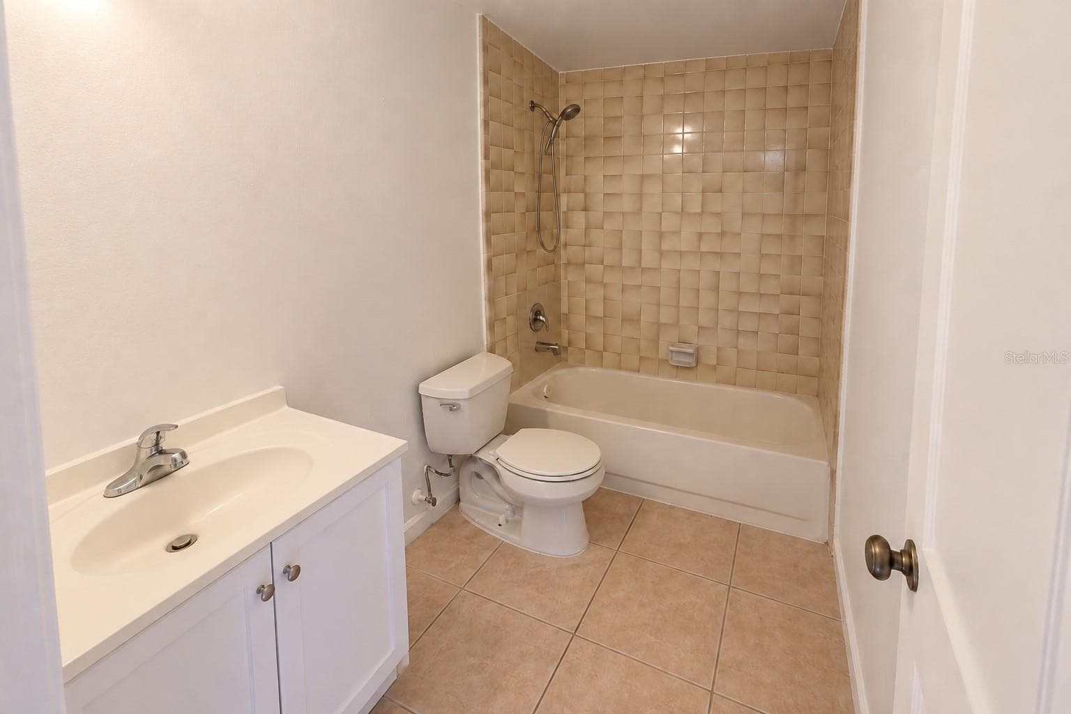 Bathroom 2 with updated shower enclosure and vanity. - 2527 CITRUS CLUB LN #3904, ORLANDO