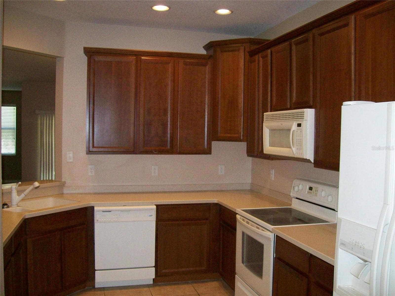 Kitchen with Pass Through - 3459 PARKRIDGE CIR #18-103, SARASOTA