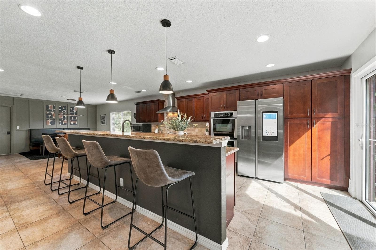 Flooded with natural light from accordian glass doors - 3006 RIVER GROVE DR, TAMPA
