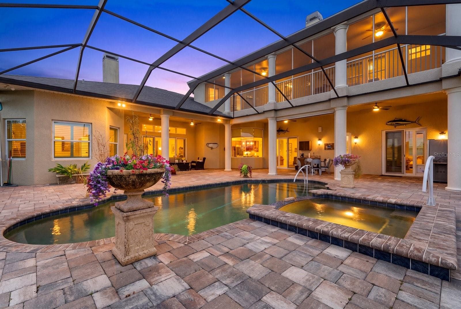 The pool deck offers two separate lounge areas surrounding the pool and spa, as well an expansive upper lanai - 520 RYE RD NE, BRADENTON