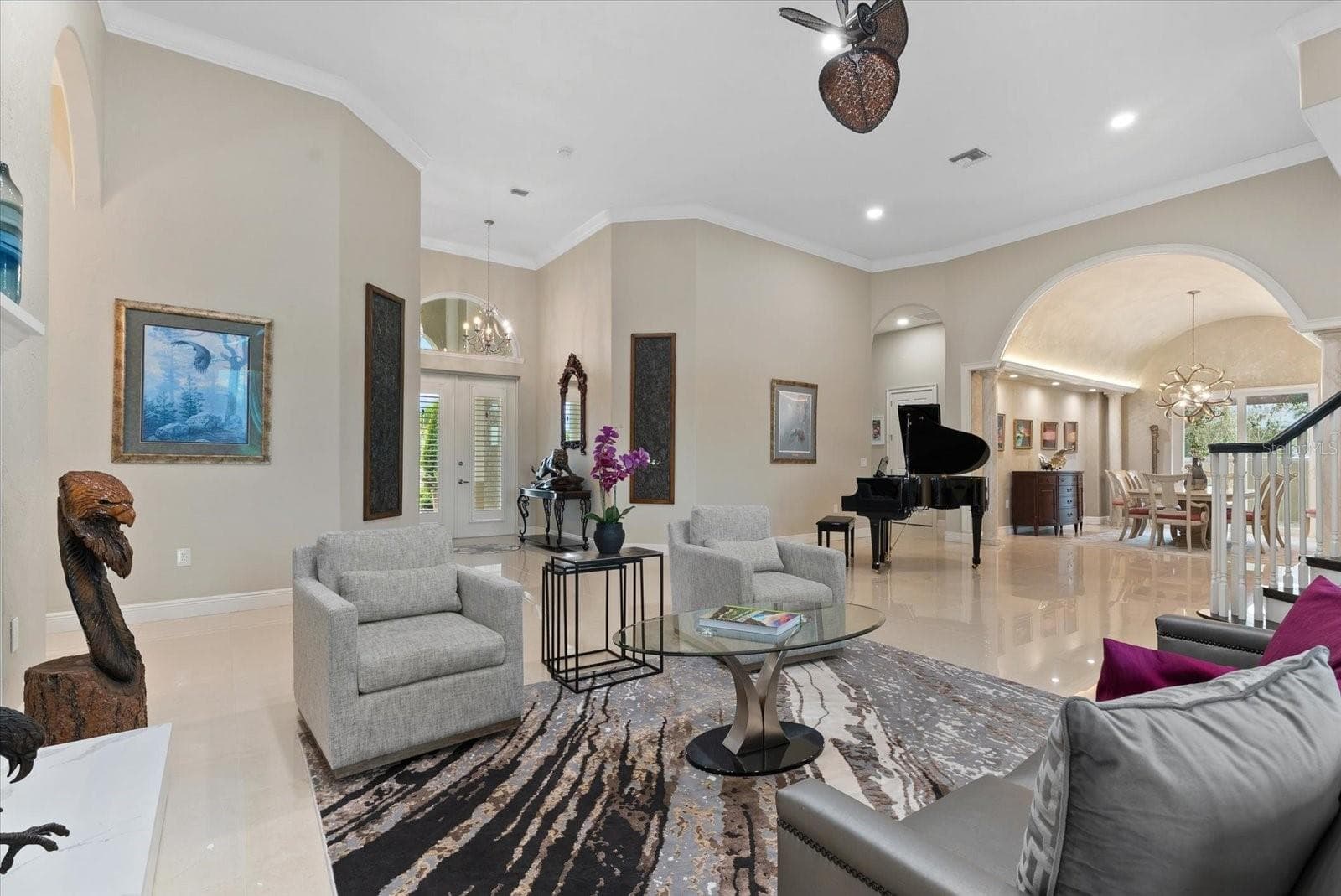 This view back towards the front entryway shows the scope of the large living room - 520 RYE RD NE, BRADENTON