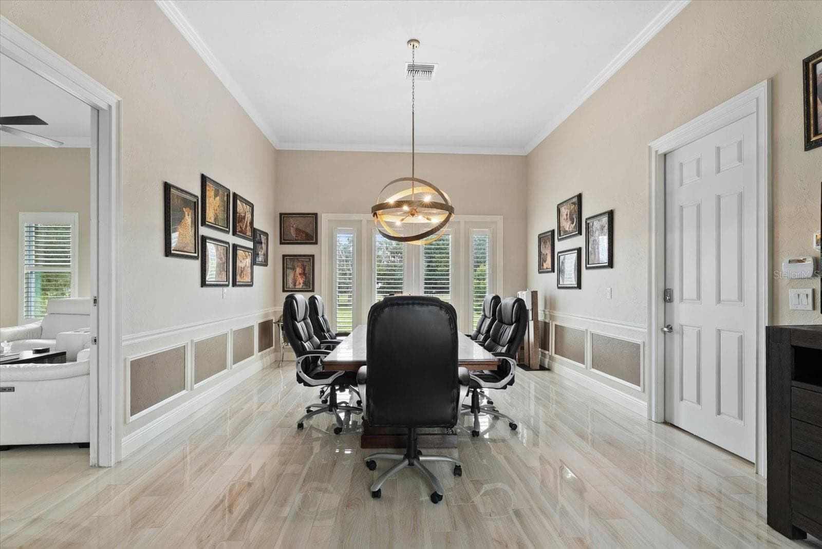 Just beyond the media room is a unique space - a full in-law suite/apartment that would serve many purposes. Thi first room is currently used as a conference room, but could also be a bedroom for the inlaw suite. - 520 RYE RD NE, BRADENTON