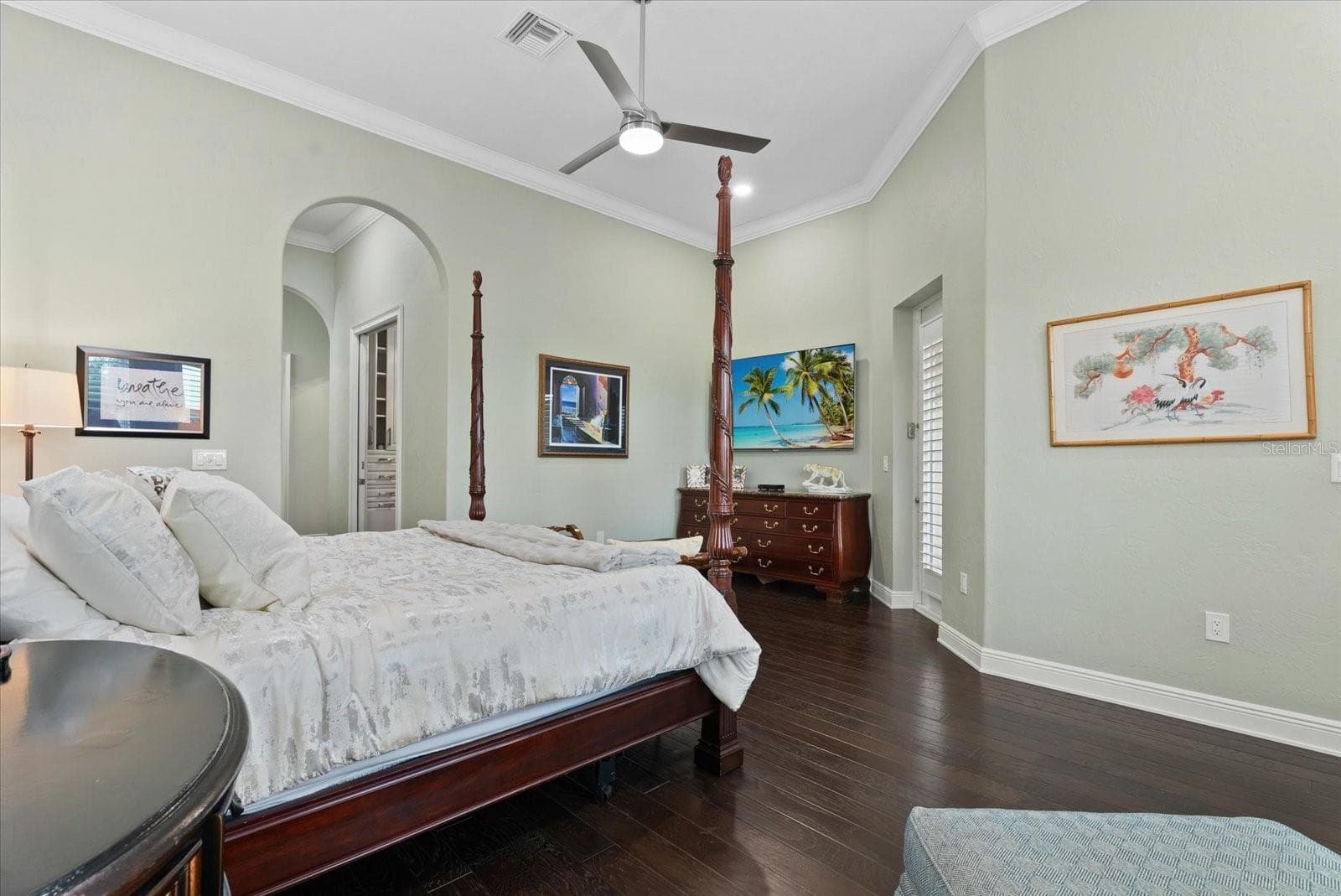 The hallway leading into the primarty suite features two walk-in closets - 520 RYE RD NE, BRADENTON