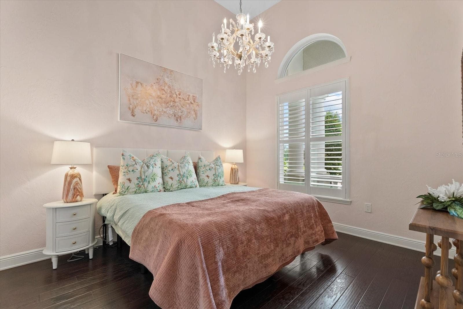 Also on the first floor is a spacious second bedroom with arched window and hardwood floors - 520 RYE RD NE, BRADENTON
