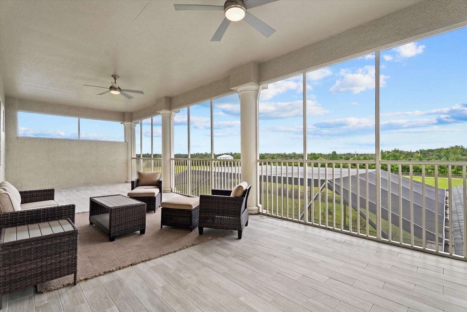 The upstairs screened lanai is truly expanive. Covered from the rain, you could make this a great game room or whatever you need this space to become - 520 RYE RD NE, BRADENTON