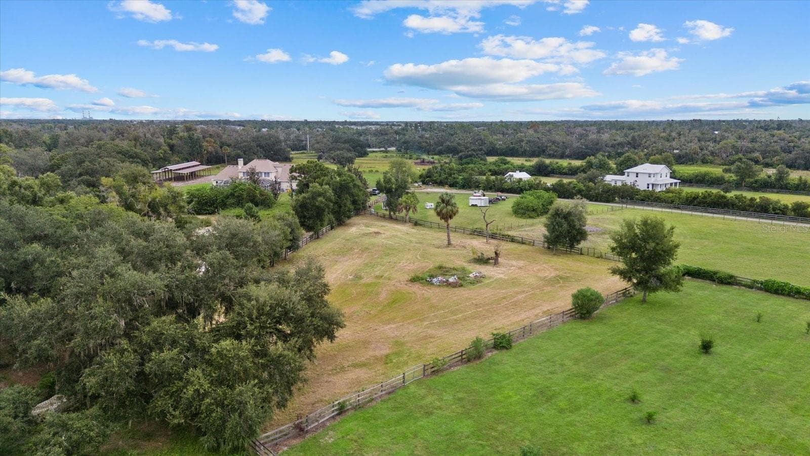 The back pasture is fenced separate from the pasture closest to the house. Ideal for goats, chickens or a horse barn - 520 RYE RD NE, BRADENTON