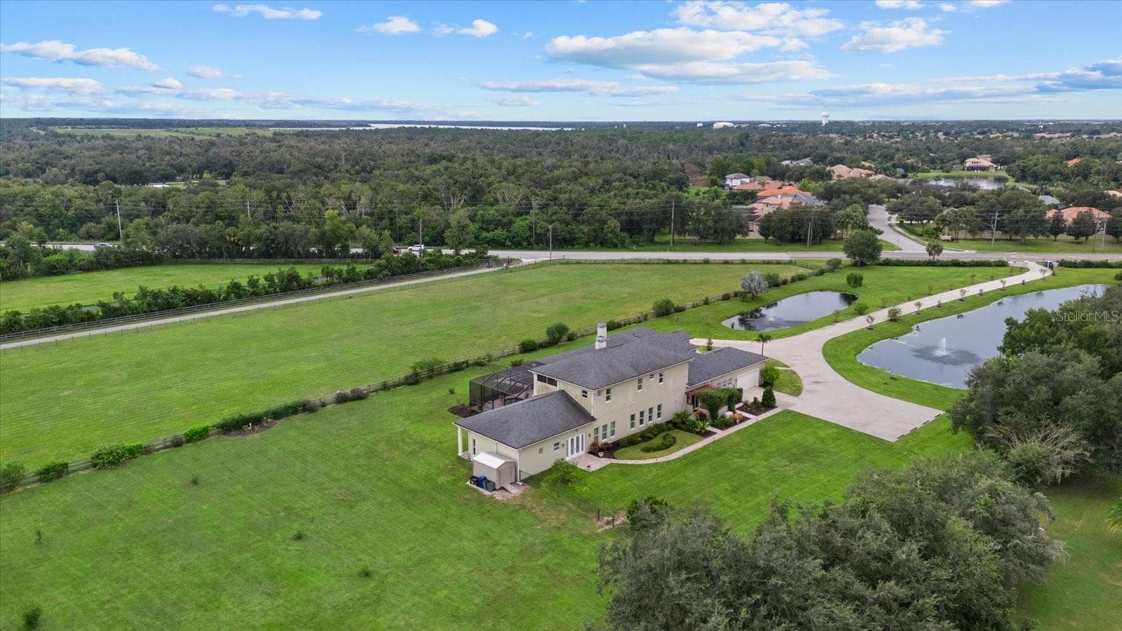 A large parking pad on the south side of the home is large enough for a motor home or bus. The walkway shown leads to the conference room/inlaw suite - 520 RYE RD NE, BRADENTON