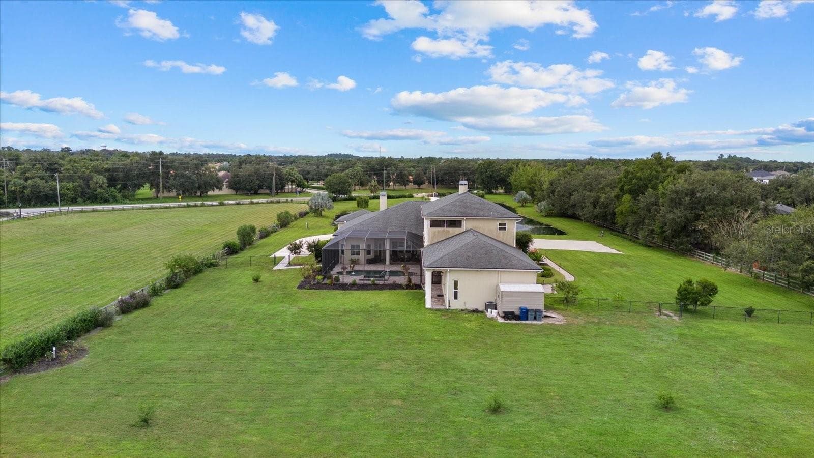 Drone photo of the home from the back pasture - 520 RYE RD NE, BRADENTON