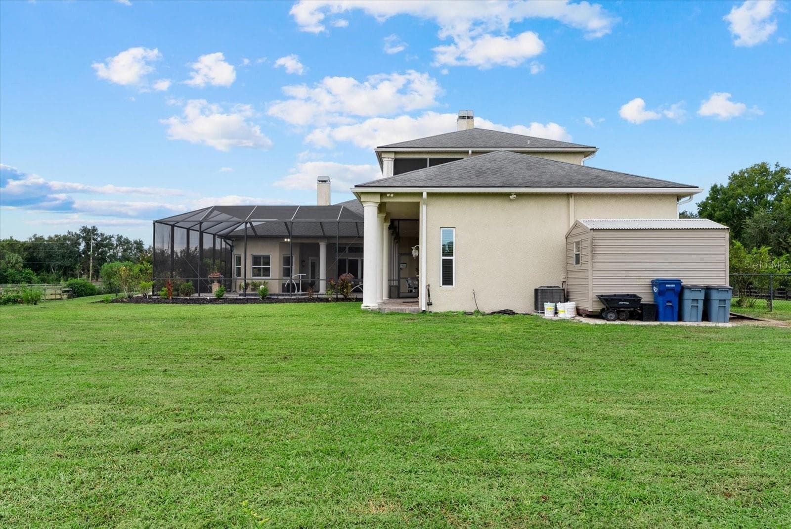 A small shed provides storage for the yard tools and things you want easy access to when in the pasture - 520 RYE RD NE, BRADENTON