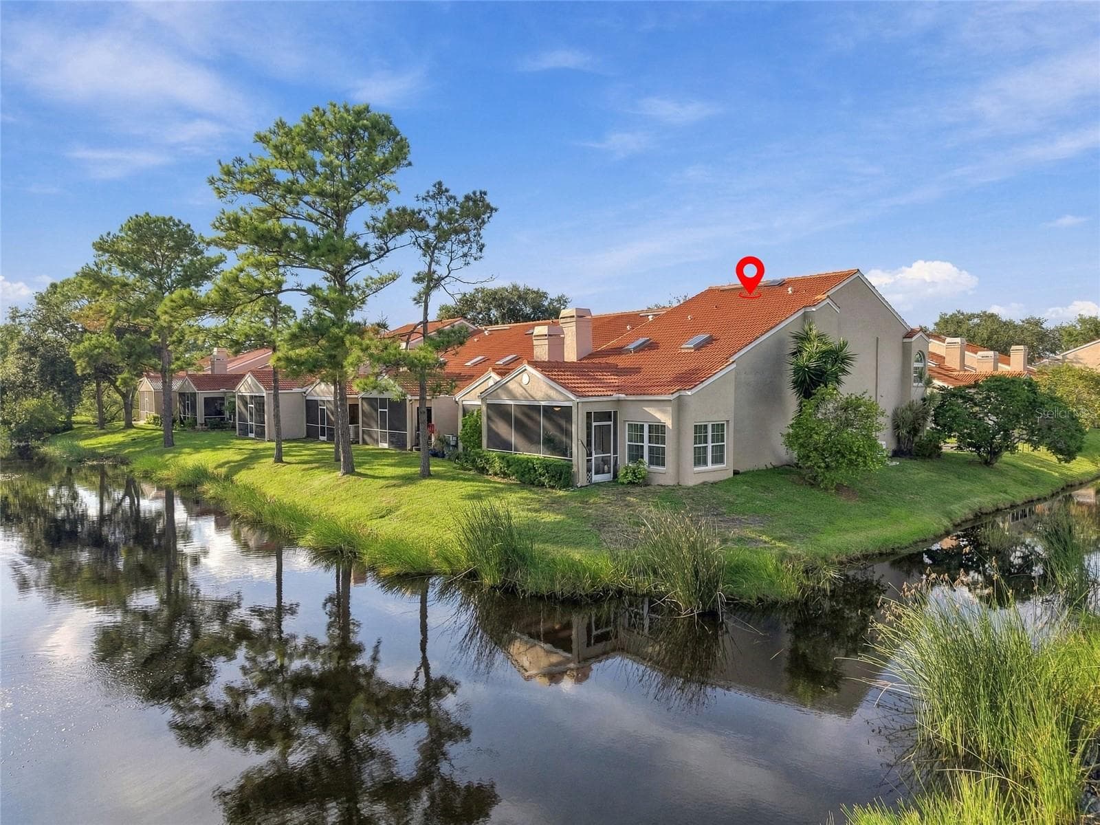 Desirable corner location surrounded by peaceful pond views, offering added privacy and a beautiful connection to nature. - 629 SEGOVIA CT NE #405, ST PETERSBURG