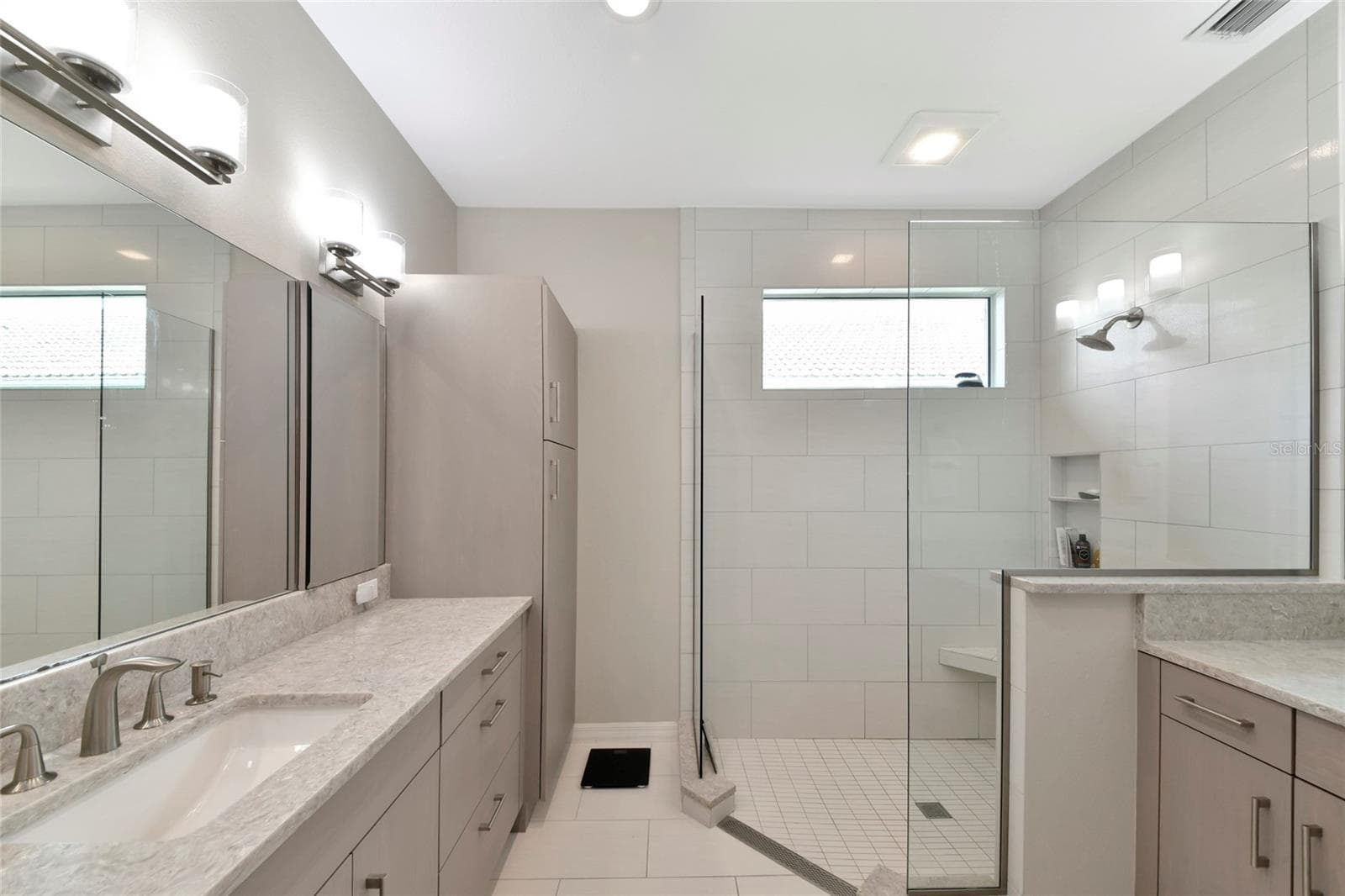New primary bath twin sinks & frameless shower. - 6256 DONNINGTON CT, SARASOTA