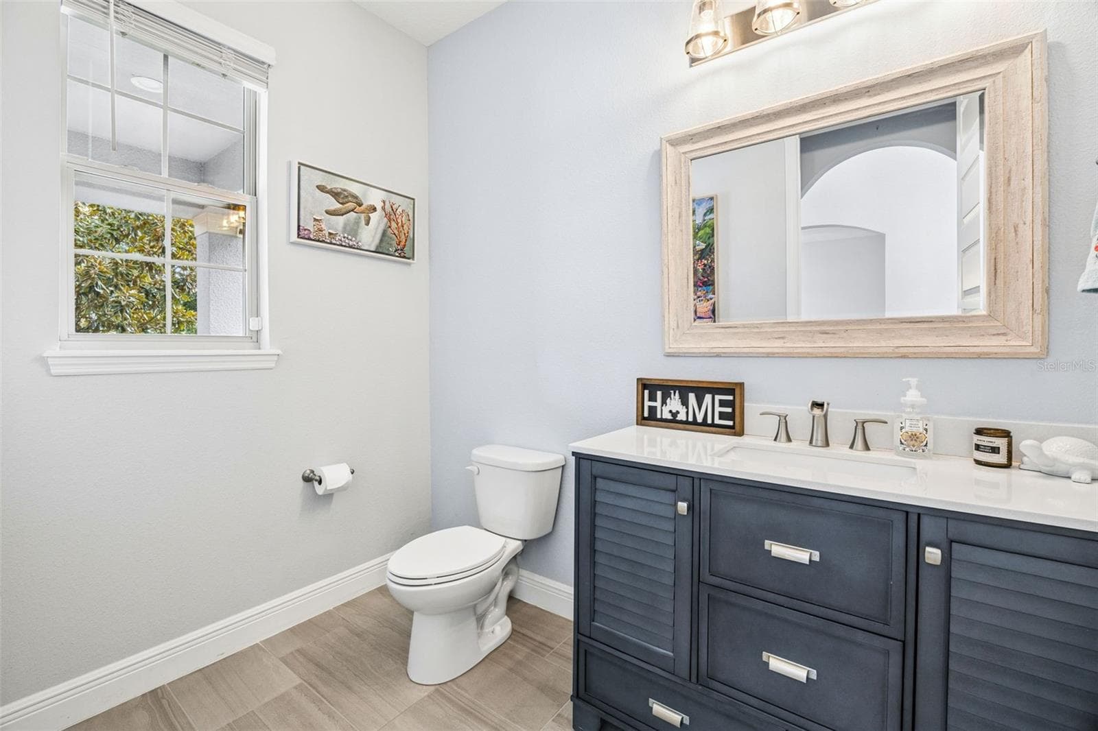 Remodeled Powder Bath with Upgraded Cabinet & Mirror - 10048 BEACH PORT DR, WINTER GARDEN