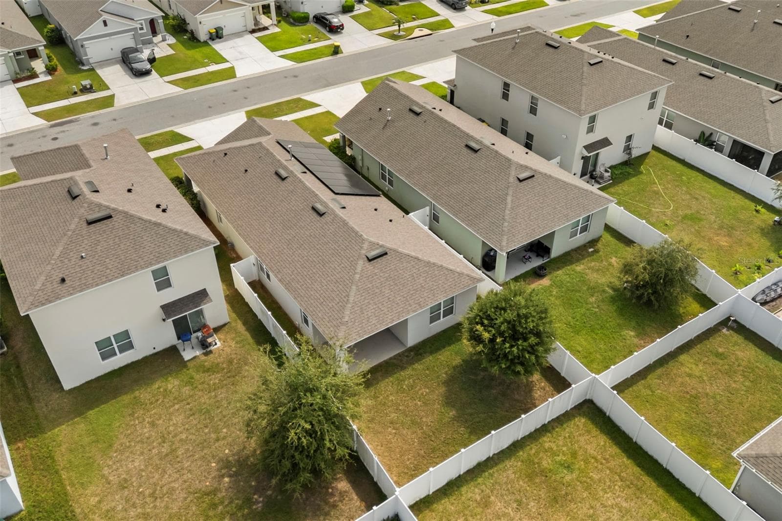 Aerial view of the home, backyard, and surrounding properties. - 3658 CASPIAN ST, LEESBURG