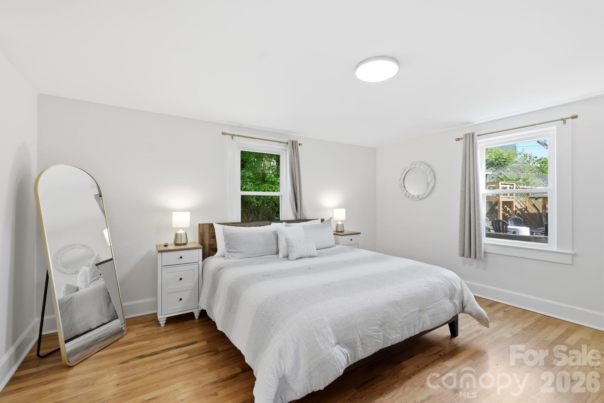 Light filled primary bedroom on main floor - 2252 Riceville Road, Asheville