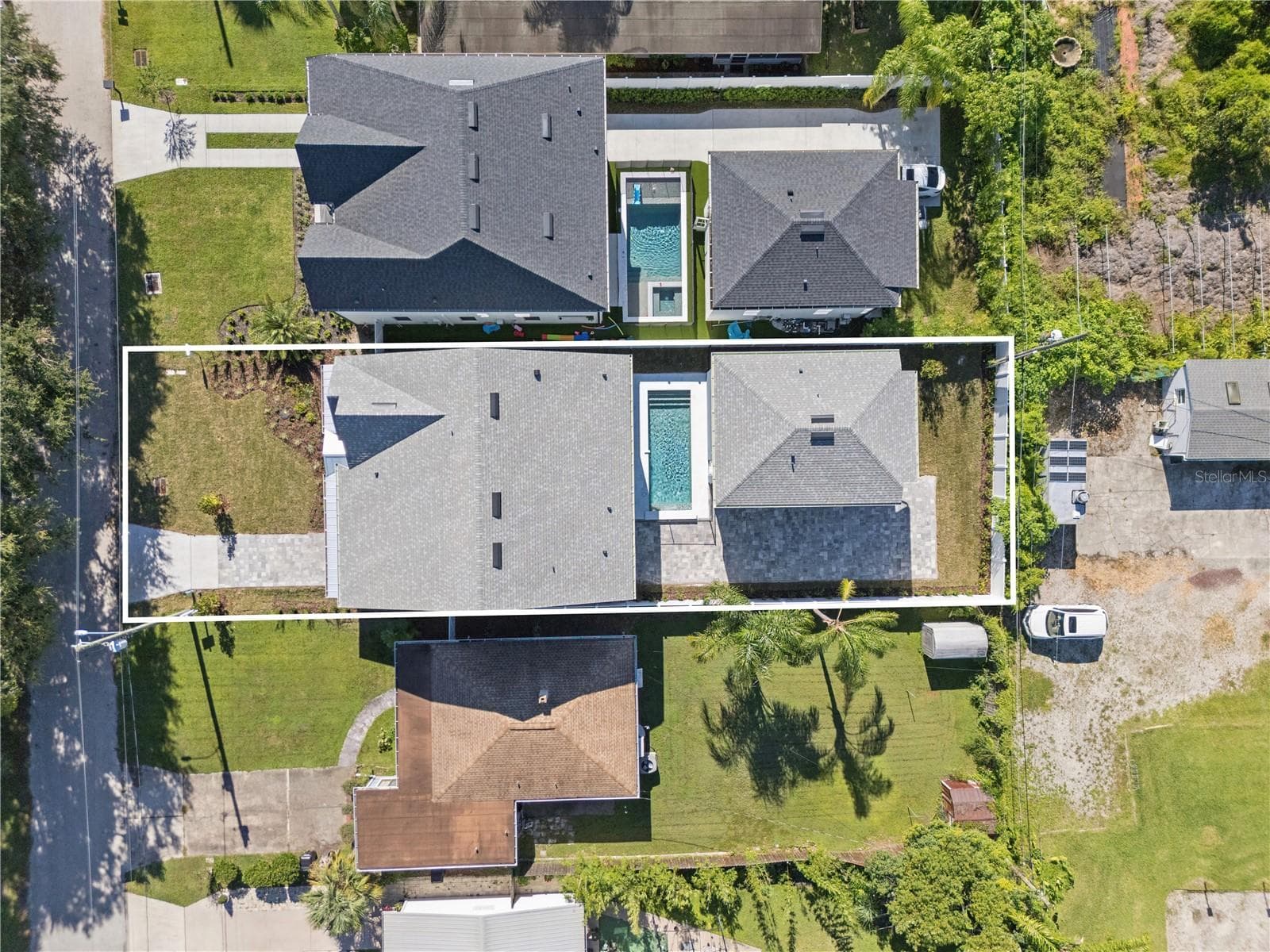 An overhead view shows the home, pool, and rear garage; neighboring properties are also pictured. - 3456 FAIRWAY LN, ORLANDO