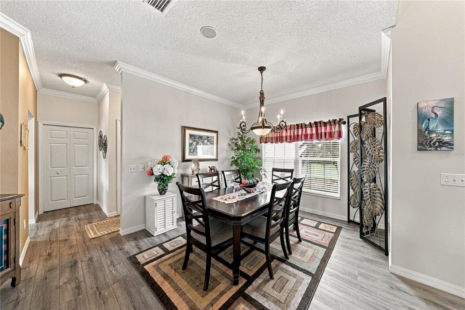 The flexibility of the dining room makes entertaining easy! The large closet pantry is in the background on the left. - 4232 DORNOCH DR, LAKE WALES