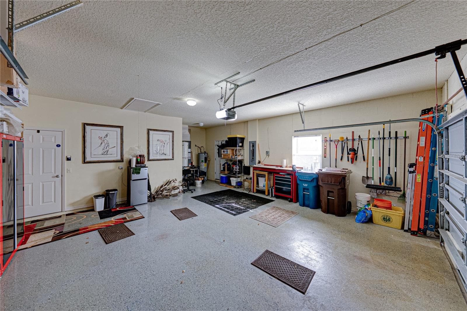 The extra wide garage allows for additional storage. - 4232 DORNOCH DR, LAKE WALES