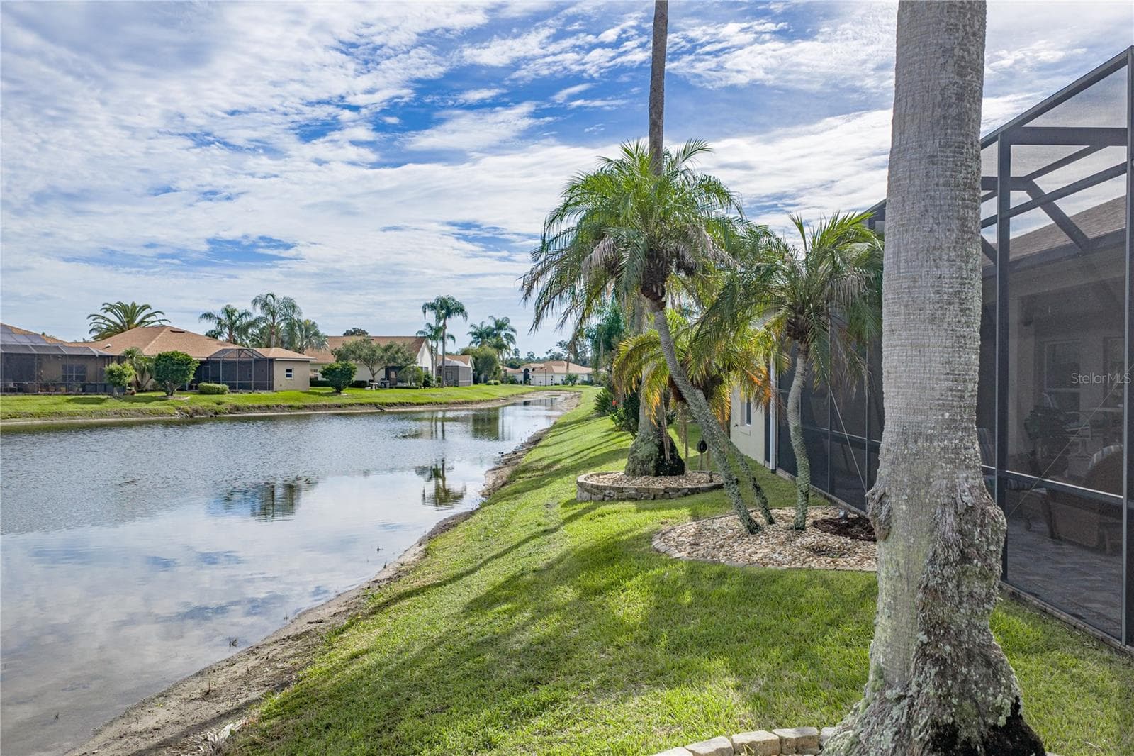 The pond extends to the east of this home. - 4232 DORNOCH DR, LAKE WALES