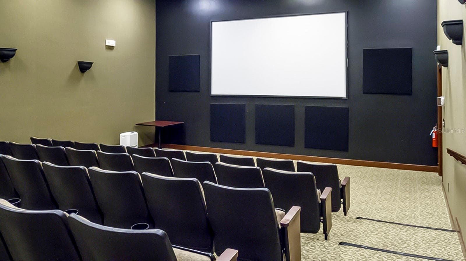 The main clubhouse movie theater has stadium seating and surround sound. Movies are free for residents. - 4232 DORNOCH DR, LAKE WALES