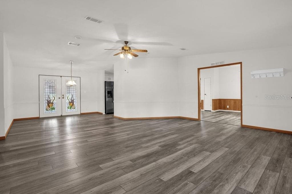 NEW FLOORING. View of Living/Dining Room - 4114 MYRTLE OAK CT #852, ZELLWOOD