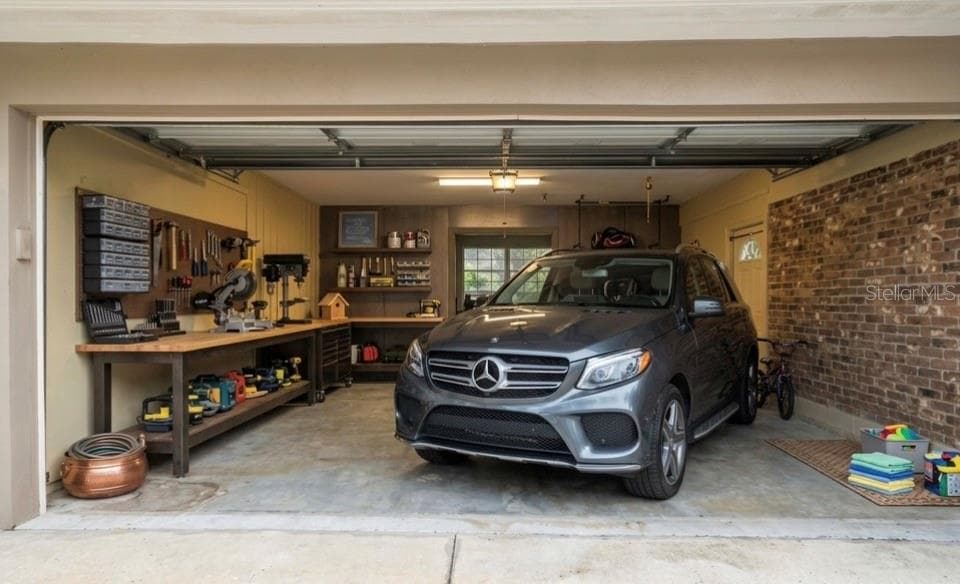 2-Car Garage w/ Rear Storage and Laundry AI Room / AI Staged - 11626 CARROLLWOOD DR, TAMPA