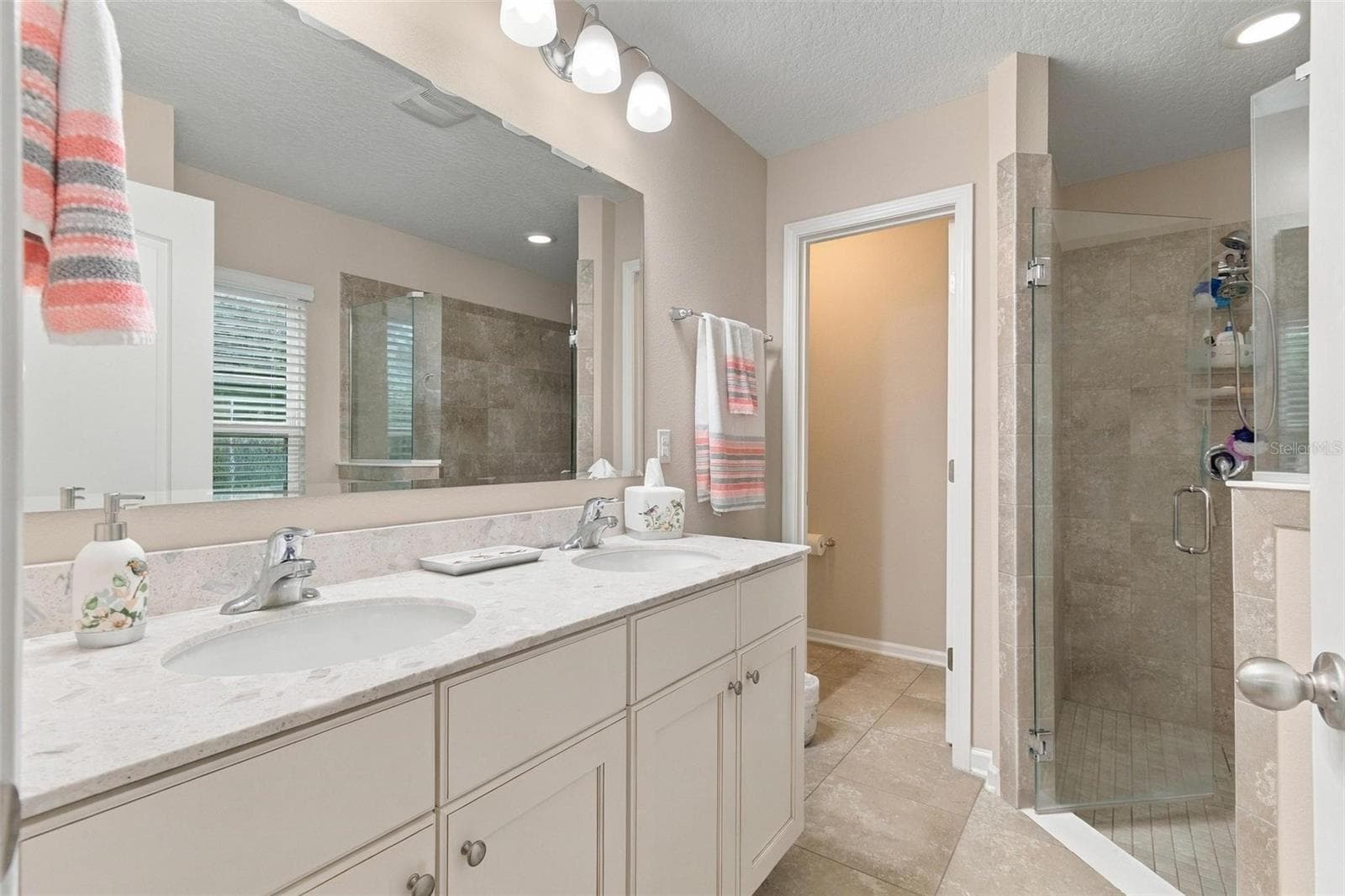 Separate shower stall and WC in primary bathroom 2 - 8 COUNTRY CLUB HARBOR CIR, PALM COAST