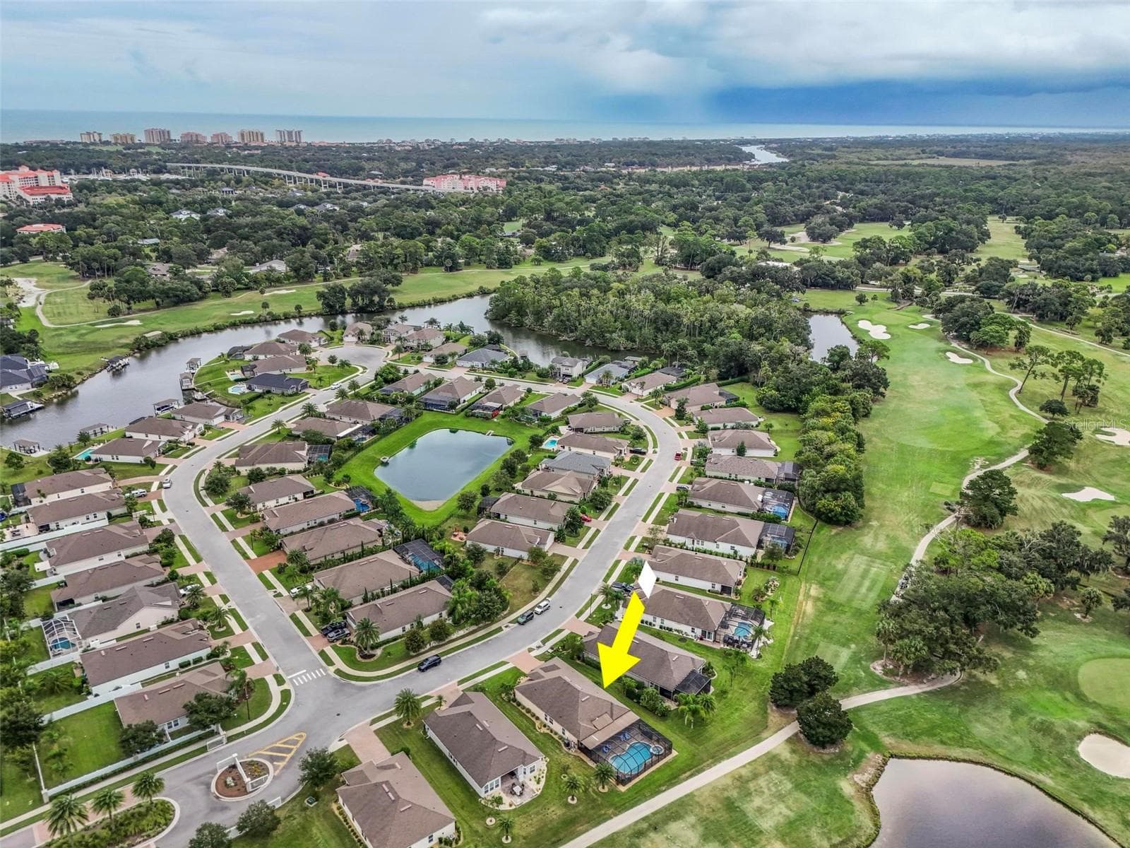 Aerial view facing east to European Village, the Atlantic Ocean and Hammock Beach - 8 COUNTRY CLUB HARBOR CIR, PALM COAST