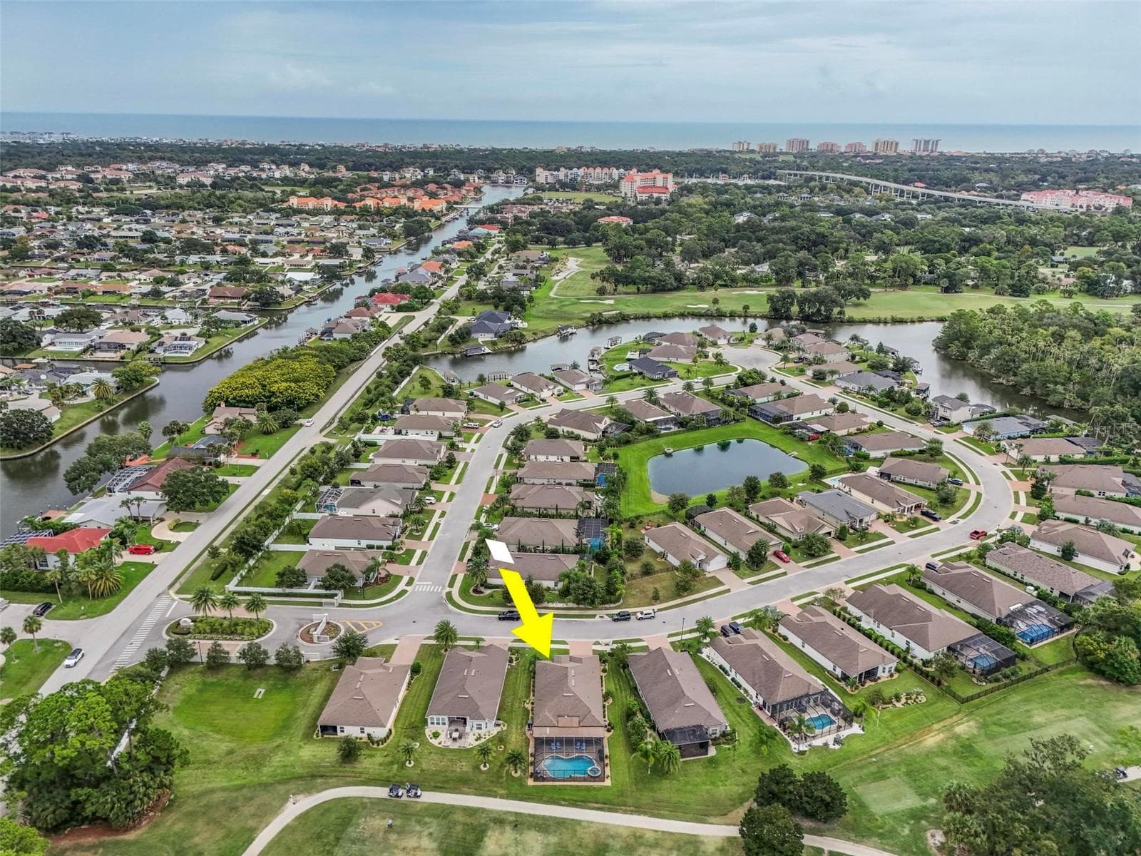 Aerial view facing east to European Village, the Atlantic Ocean and Hammock Beach - 8 COUNTRY CLUB HARBOR CIR, PALM COAST