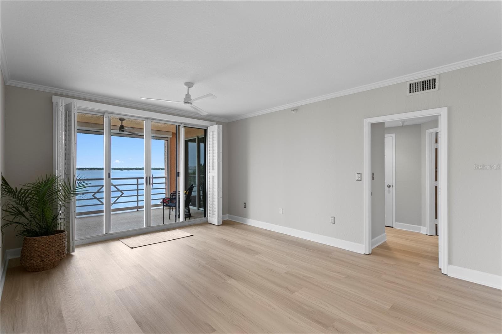 Living Area with Adjacent Primary Suite Entrance - 4961 BACOPA LN S #201, ST PETERSBURG