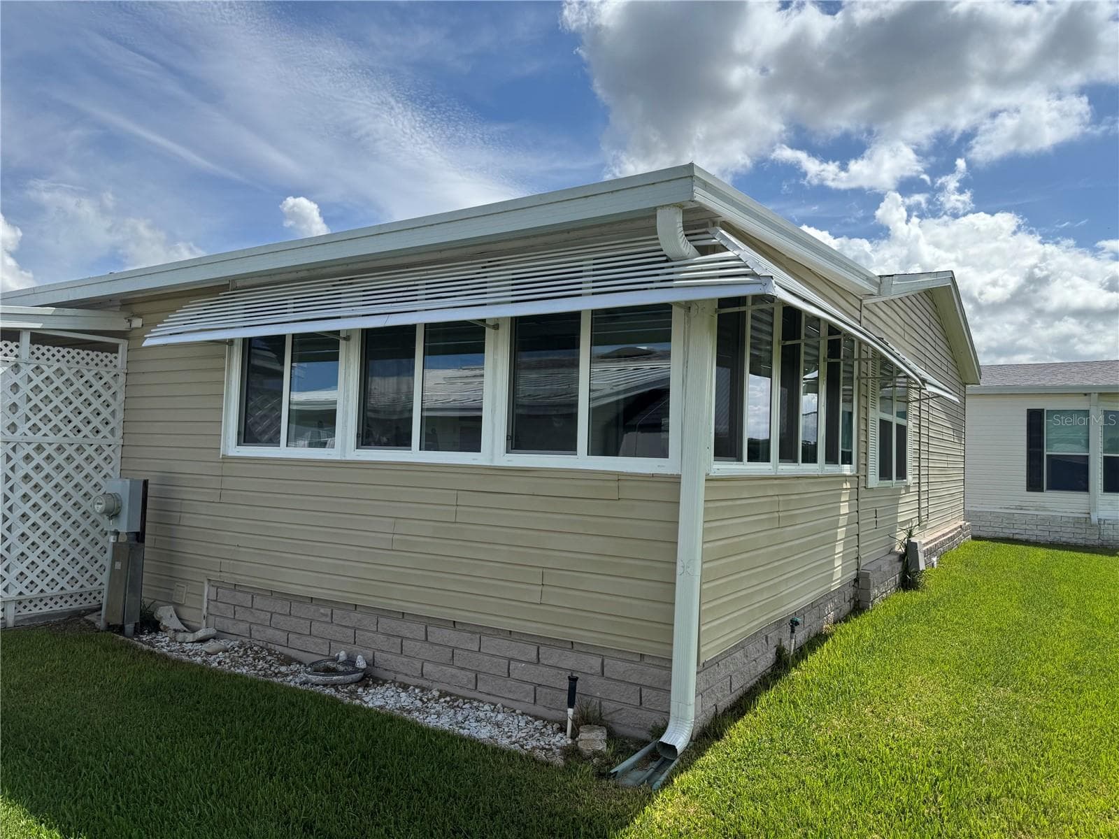 Rear view -Florida Room that looks over golf course - 57 STRAPHMORE DR, HAINES CITY