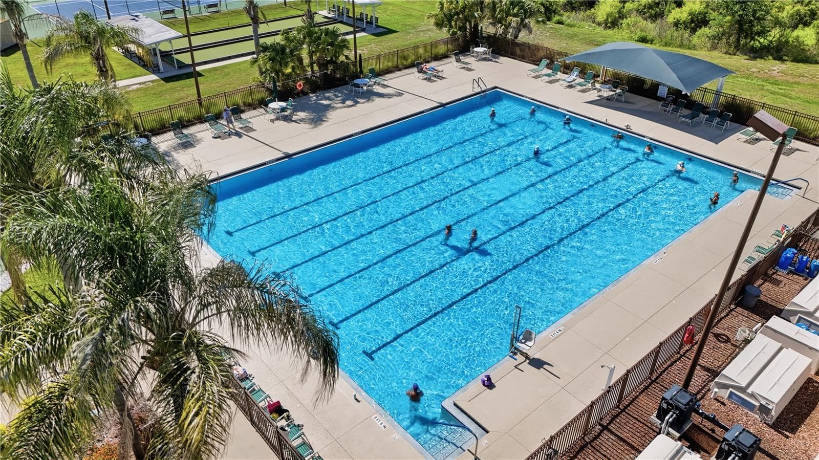 The OUTDOOR POOL is perfect for taking laps or just lounging poolside. - 21736 PRINCESS GRACE CT, LEESBURG