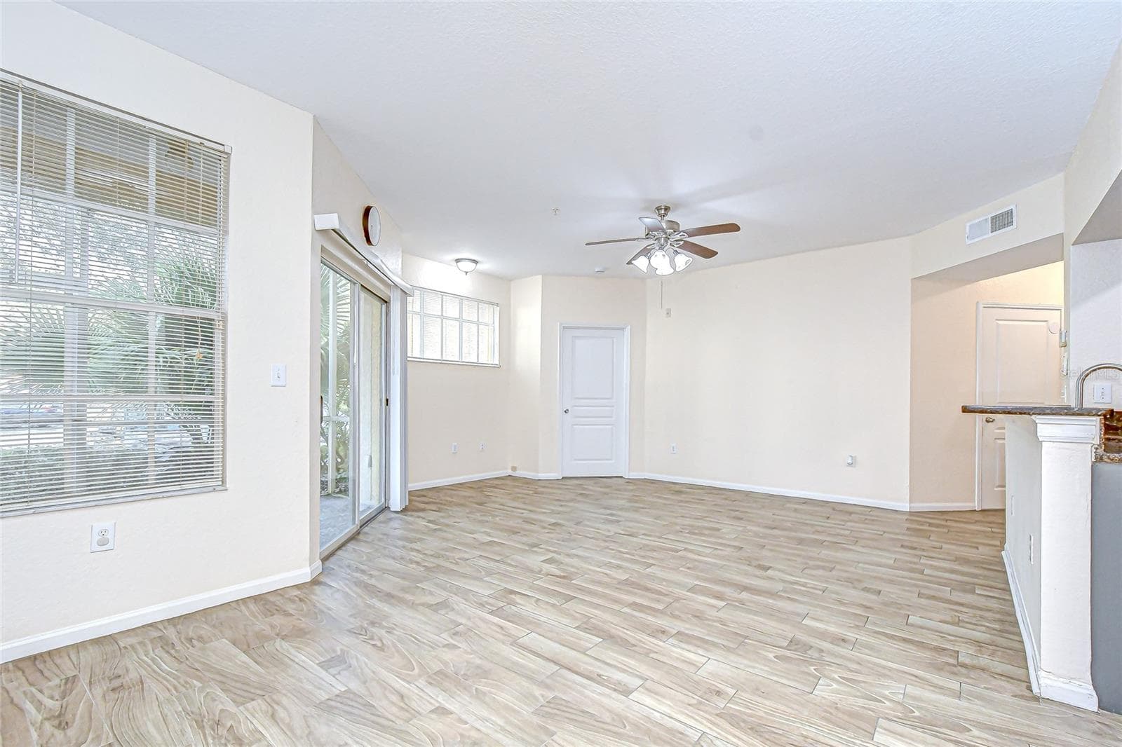 Spacious living area filled with natural light provides a comfortable setting for everyday living. - 5125 PALM SPRINGS BLVD #3104, TAMPA