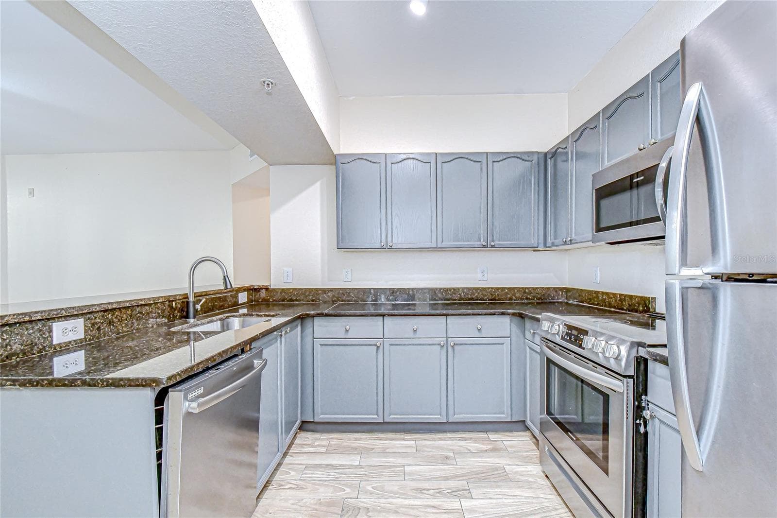 Well-appointed kitchen offers ample storage and generous preparation space. - 5125 PALM SPRINGS BLVD #3104, TAMPA