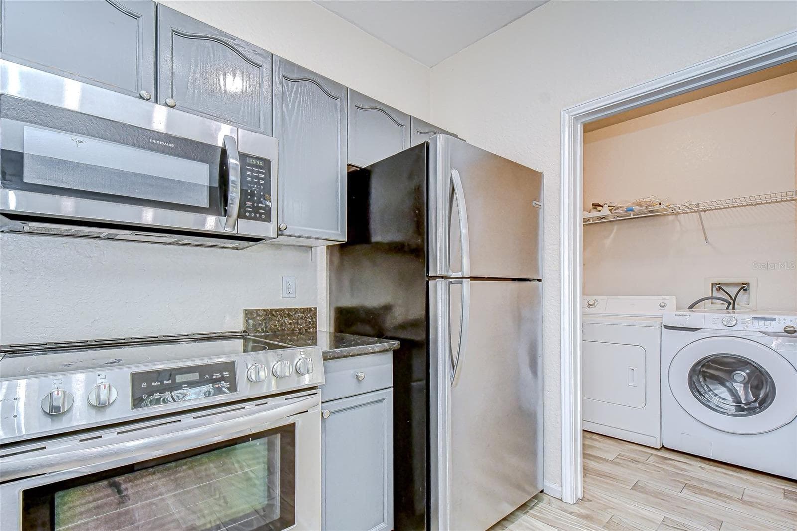 Stainless appliances provide a clean and modern finish. - 5125 PALM SPRINGS BLVD #3104, TAMPA