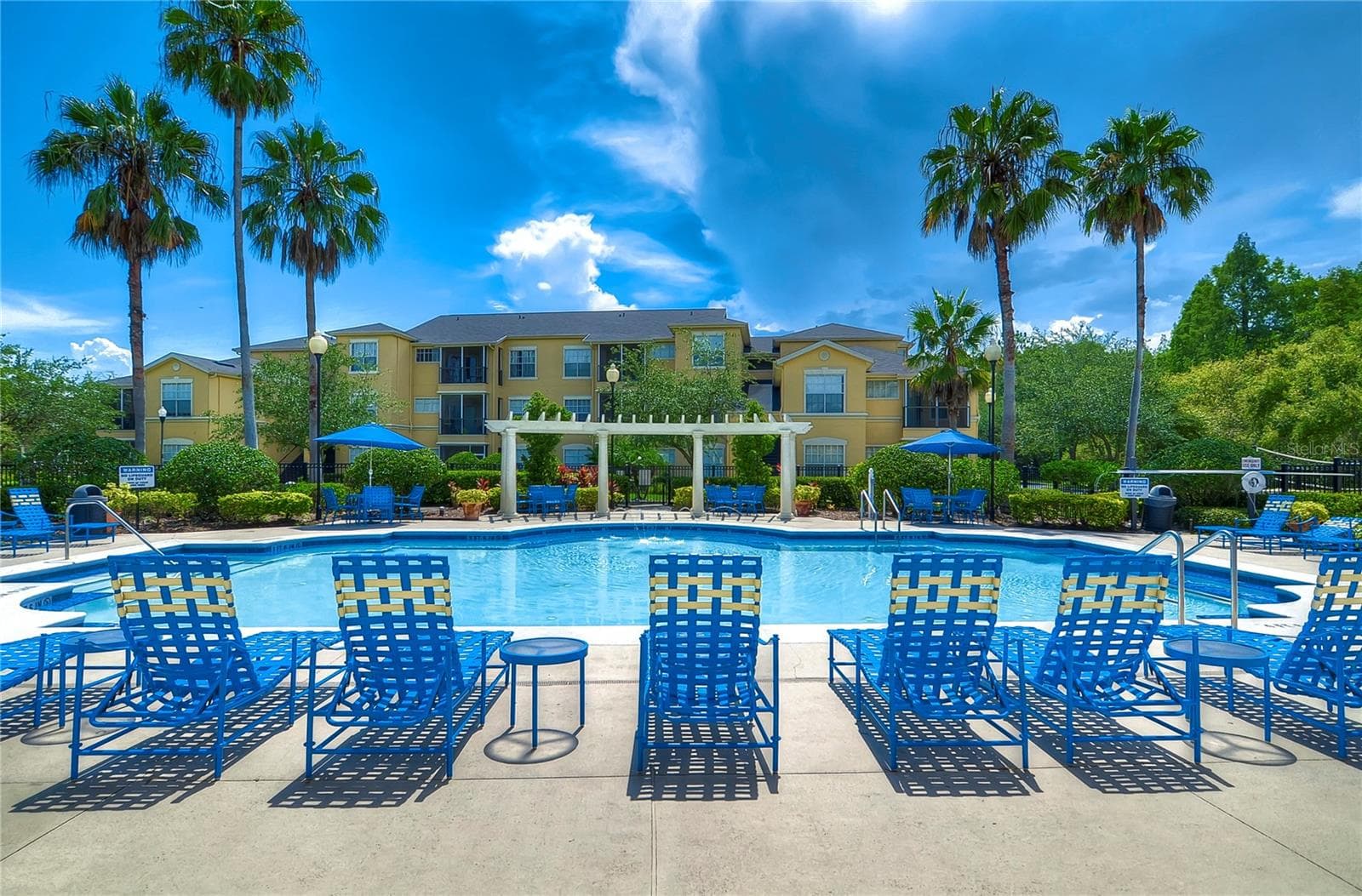 Three community swimming pools provide multiple options for recreation and relaxation. - 5125 PALM SPRINGS BLVD #3104, TAMPA
