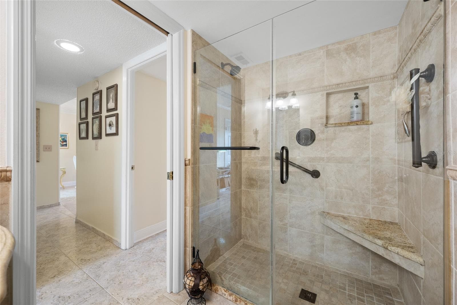 2nd Bathroom with Walk-in Shower, Frameless Shower Door, Custom Travertine Tile - 2700 COVE CAY DR #1-3B, CLEARWATER
