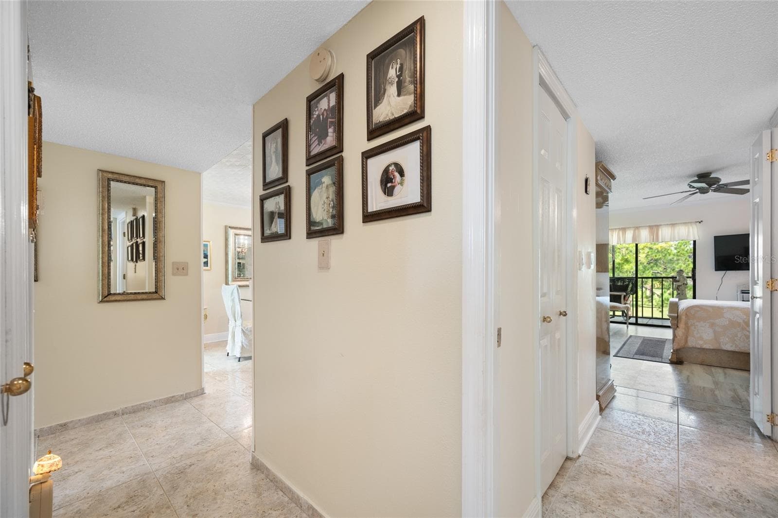 Hallway leading from living area lo primary bedroom - 2700 COVE CAY DR #1-3B, CLEARWATER