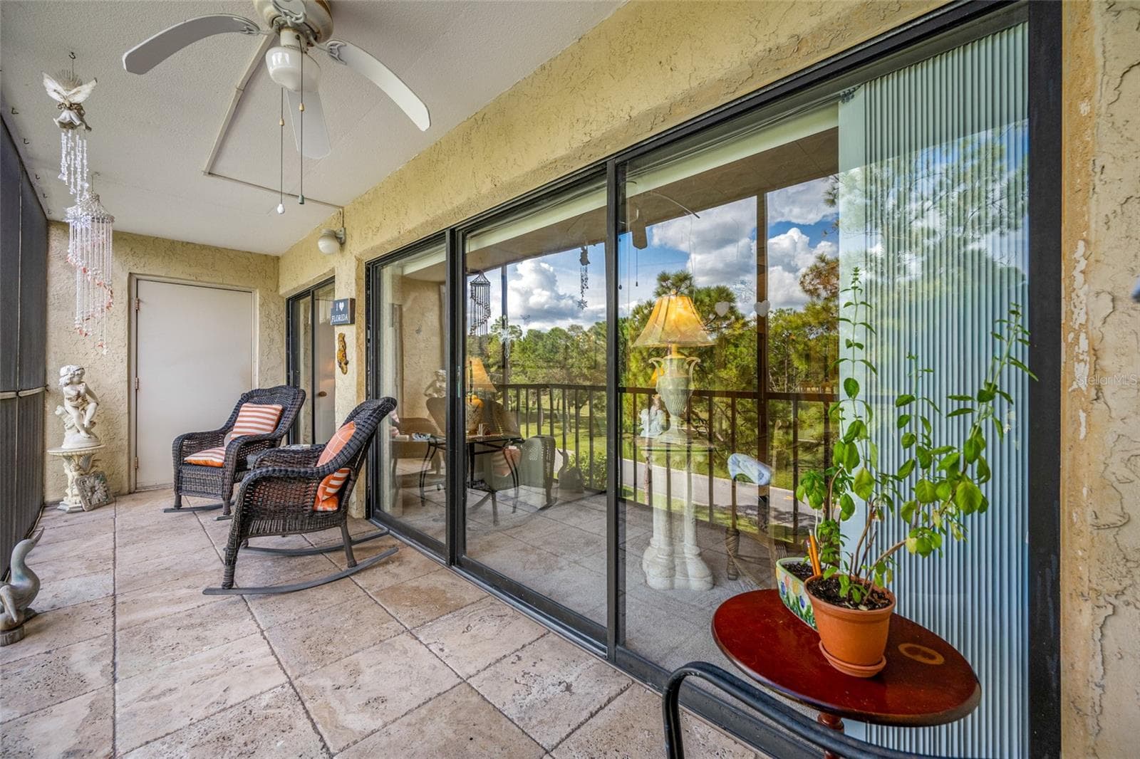 Lanai with sliding door access to living area and primary bedroom - 2700 COVE CAY DR #1-3B, CLEARWATER