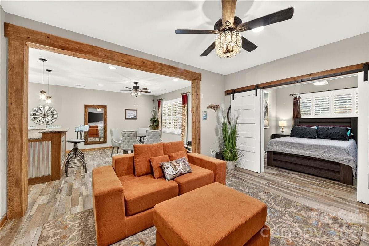 Living room barn doors with separate bedroom - 3093 Hartson Pointe Drive, Fort Mill